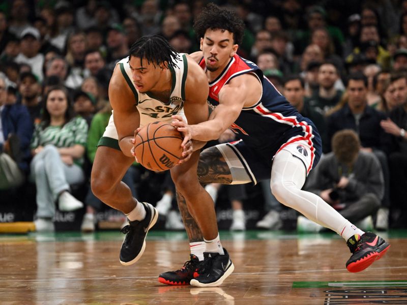 BOSTON, MASSACHUSETTS - APRIL 14: Jules Bernard #14 of the Washington Wizards defends Jaden Springer #44 of the Boston Celtics during the second quarter at the TD Garden on April 14, 2024 in Boston, Massachusetts. NOTE TO USER: User expressly acknowledges and agrees that, by downloading and or using this photograph, User is consenting to the terms and conditions of the Getty Images License Agreement. (Photo by Brian Fluharty/Getty Images)