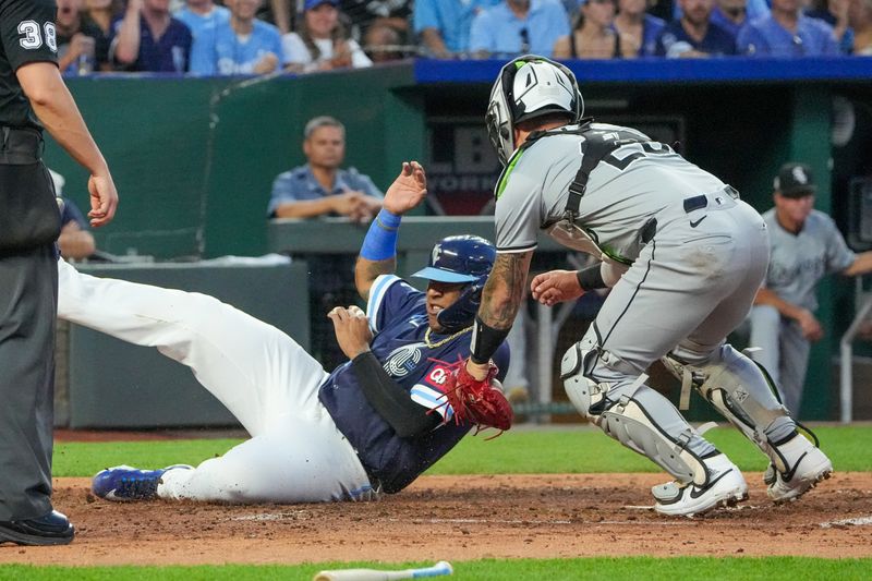 Jul 19, 2024; Kansas City, Missouri, USA; Chicago White Sox catcher Korey Lee (26) misses the tag as Kansas City Royals catcher Salvador Perez (13) scores in the fifth inning at Kauffman Stadium. Mandatory Credit: Denny Medley-USA TODAY Sports