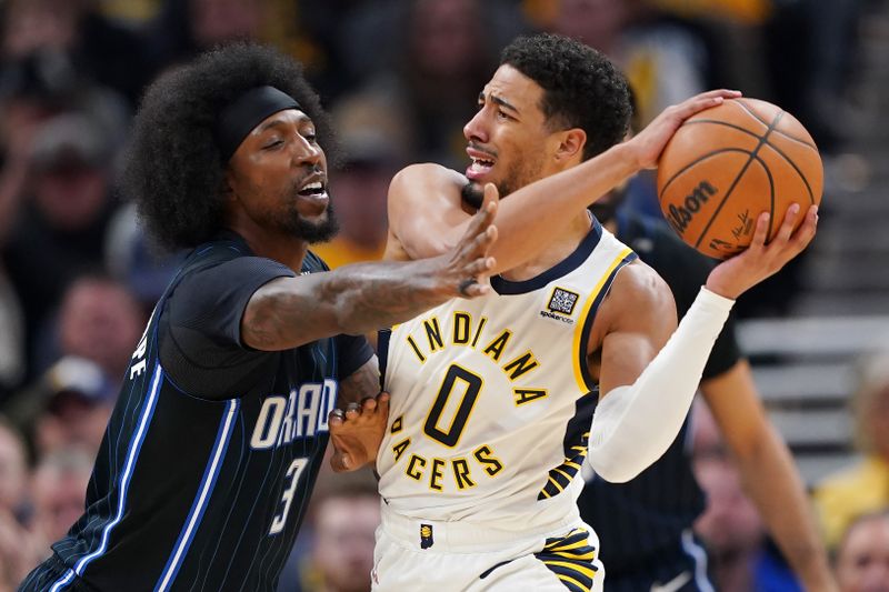 INDIANAPOLIS, INDIANA - NOVEMBER 06: Tyrese Haliburton #0 of the Indiana Pacers handles the ball while being guarded by Kentavious Caldwell-Pope #3 of the Orlando Magic in the first quarter at Gainbridge Fieldhouse on November 06, 2024 in Indianapolis, Indiana. NOTE TO USER: User expressly acknowledges and agrees that, by downloading and or using this photograph, User is consenting to the terms and conditions of the Getty Images License Agreement. (Photo by Dylan Buell/Getty Images)