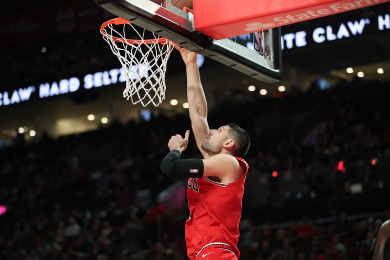 PORTLAND, OREGON - JANUARY 28: Nikola Vucevic #9 of the Chicago Bulls dunks against the Portland Trail Blazers during the second quarter at Moda Center on January 28, 2024 in Portland, Oregon. NOTE TO USER: User expressly acknowledges and agrees that, by downloading and or using this photograph, User is consenting to the terms and conditions of the Getty Images License Agreement.? (Photo by Amanda Loman/Getty Images)