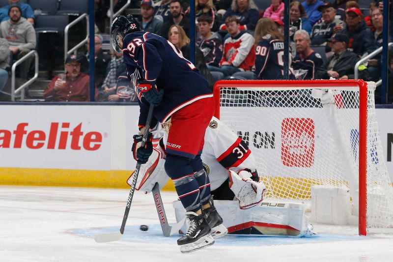 Mar 14, 2024; Columbus, Ohio, USA; Columbus Blue Jackets center Boone Jenner’s (38) (not pictured) shot slides past Ottawa Senators goalie Anton Forsberg (31) for a goal during the first period at Nationwide Arena. Mandatory Credit: Russell LaBounty-USA TODAY Sports