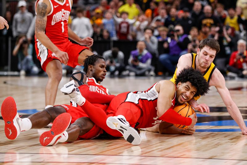 Mar 9, 2023; Chicago, IL, USA; Ohio State Buckeyes forward Justice Sueing (14) tries to keep the ball away from Iowa Hawkeyes forward Filip Rebraca (0) during the second half at United Center. Mandatory Credit: Kamil Krzaczynski-USA TODAY Sports