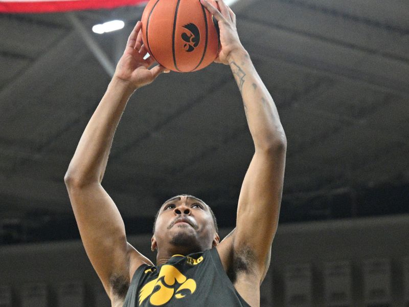 Feb 2, 2024; Iowa City, Iowa, USA; Iowa Hawkeyes guard Tony Perkins (11) goes to the basket against the Ohio State Buckeyes during the second half at Carver-Hawkeye Arena. Mandatory Credit: Jeffrey Becker-USA TODAY Sports