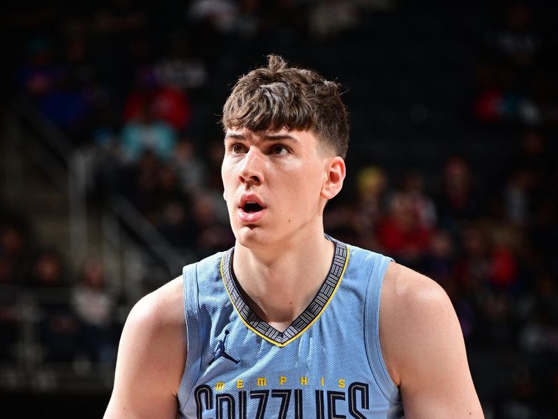 DETROIT, MI - APRIL 1: Jake LaRavia #3 of the Memphis Grizzlies shoots a free throw during the game against the Detroit Pistons  on April 1, 2024 at Little Caesars Arena in Detroit, Michigan. NOTE TO USER: User expressly acknowledges and agrees that, by downloading and/or using this photograph, User is consenting to the terms and conditions of the Getty Images License Agreement. Mandatory Copyright Notice: Copyright 2024 NBAE (Photo by Chris Schwegler/NBAE via Getty Images)