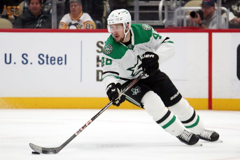 Nov 11, 2024; Pittsburgh, Pennsylvania, USA;  Dallas Stars defenseman Ilya Lyubushkin (46) moves the puck against the Pittsburgh Penguins during the first period at PPG Paints Arena. Mandatory Credit: Charles LeClaire-Imagn Images
