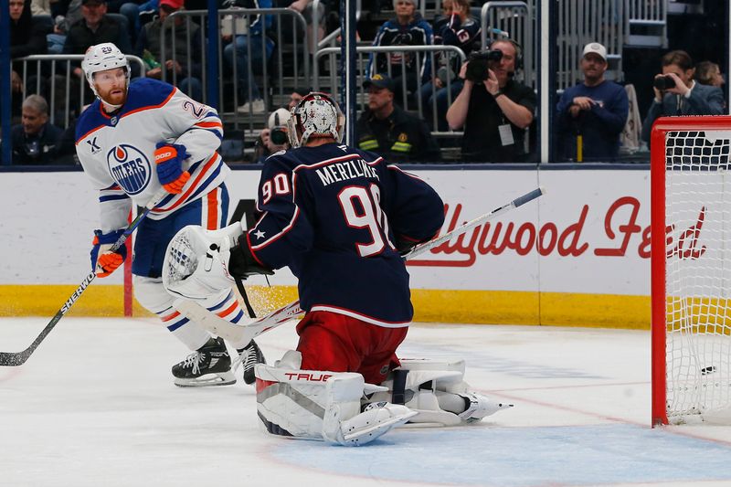 Oct 28, 2024; Columbus, Ohio, USA; Columbus Blue Jackets goalie Elvis Merzlikins (90) makes a save on the shot from Edmonton Oilers center Connor Brown (28) during the third period at Nationwide Arena. Mandatory Credit: Russell LaBounty-Imagn Images