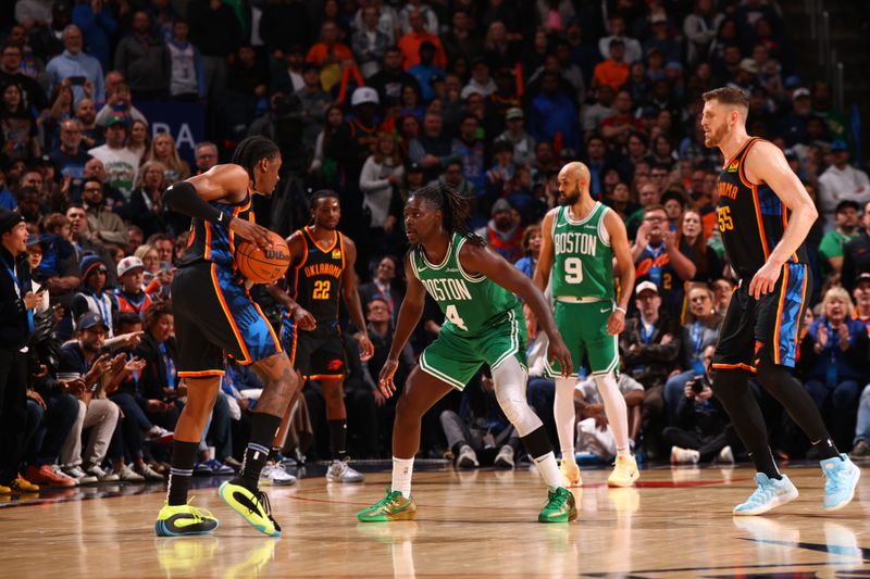 OKLAHOMA CITY, OK - JANUARY 5: Jalen Williams #8 of the Oklahoma City Thunder handles the ball while Jrue Holiday #4 of the Boston Celtics plays defense during the game on January 5, 2025 at Paycom Center in Oklahoma City, Oklahoma. NOTE TO USER: User expressly acknowledges and agrees that, by downloading and or using this photograph, User is consenting to the terms and conditions of the Getty Images License Agreement. Mandatory Copyright Notice: Copyright 2025 NBAE (Photo by Zach Beeker/NBAE via Getty Images)