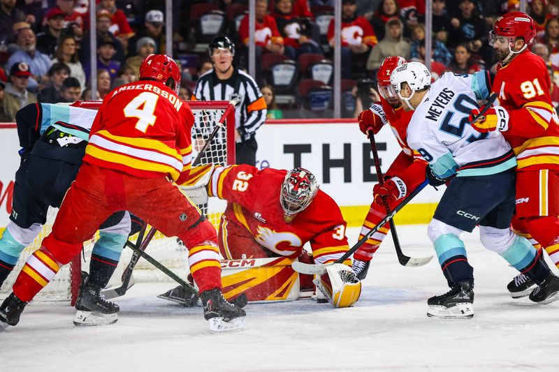 Dec 18, 2025; Calgary, Alberta, CAN; Calgary Flames goaltender Dustin Wolf (32) makes a save against Seattle Kraken center Ben Meyers (59) during the first period at Scotiabank Saddledome. Mandatory Credit: Sergei Belski-Imagn Images