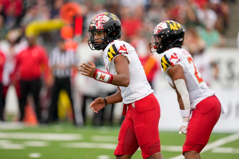 Sep 10, 2022; Charlotte, North Carolina, USA;Maryland Terrapins quarterback Taulia Tagovailoa (3) motions to a reciever during the second quarter against the Charlotte 49ers at Jerry Richardson Stadium. Mandatory Credit: Jim Dedmon-USA TODAY Sports