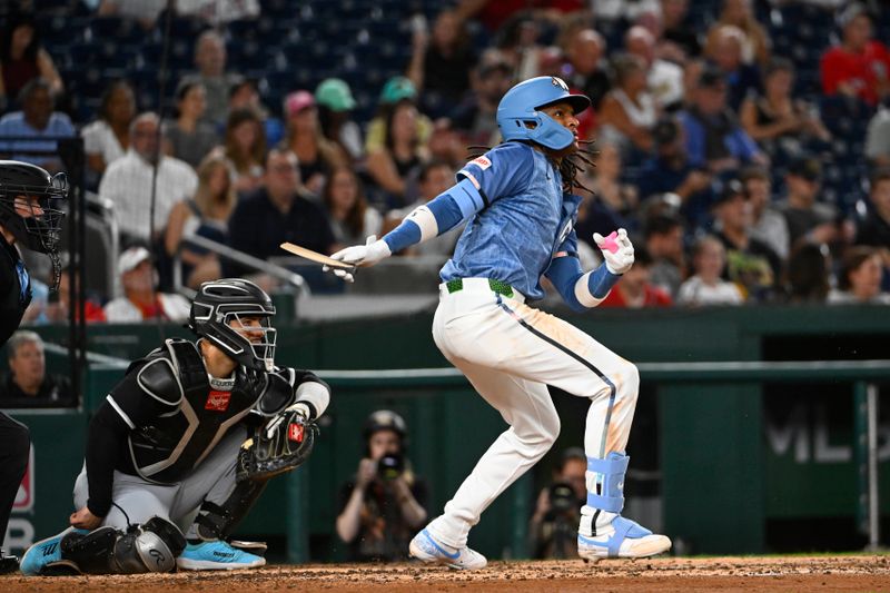 Sep 26, 2025; Washington, District of Columbia, USA; Washington Nationals shortstop CJ Abrams (5) singles against the Chicago White Sox during the fourth inning at Nationals Park. Mandatory Credit: Brad Mills-Imagn Images