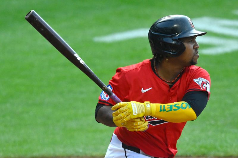 May 21, 2024; Cleveland, Ohio, USA; Cleveland Guardians third baseman Jose Ramirez (11) hits an RBI double in the third inning against the New York Mets at Progressive Field. Mandatory Credit: David Richard-USA TODAY Sports