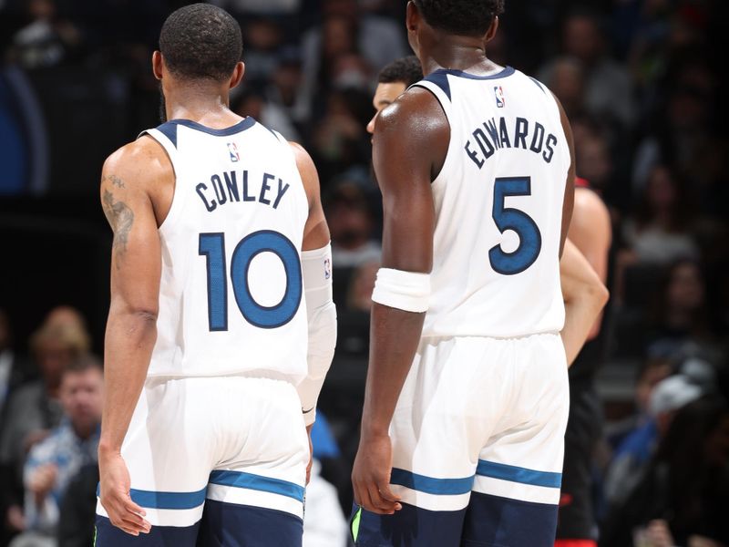 MINNEAPOLIS, MN -  FEBRUARY 4: Mike Conley #10 and Anthony Edwards #5 of the Minnesota Timberwolves during the game against the Houston Rockets on February 4, 2024 at Target Center in Minneapolis, Minnesota. NOTE TO USER: User expressly acknowledges and agrees that, by downloading and or using this Photograph, user is consenting to the terms and conditions of the Getty Images License Agreement. Mandatory Copyright Notice: Copyright 2024 NBAE (Photo by David Sherman/NBAE via Getty Images)