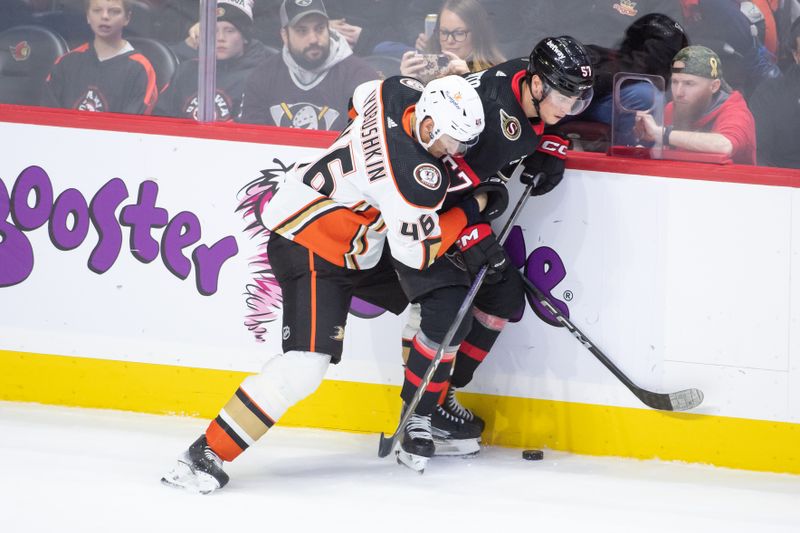 Feb 15, 2024; Ottawa, Ontario, CAN; Anaheim Ducks defenseman Ilya Lyubushkin (46) battles with Ottawa Senators center Shane Pinto (57) in the third period at the Canadian Tire Centre. Mandatory Credit: Marc DesRosiers-USA TODAY Sports