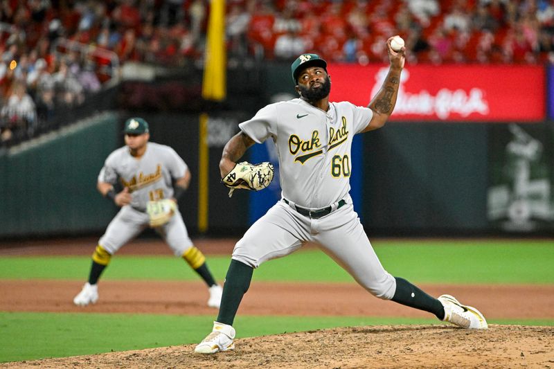 Aug 14, 2023; St. Louis, Missouri, USA;  Oakland Athletics relief pitcher Francisco Perez (60) pitches against the St. Louis Cardinals during the seventh inning at Busch Stadium. Mandatory Credit: Jeff Curry-USA TODAY Sports