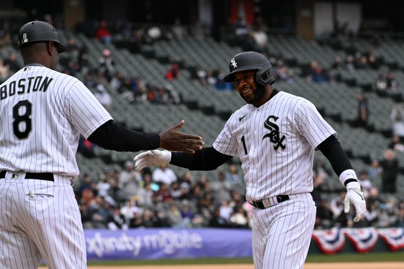 Apr 5, 2023; Chicago, Illinois, USA;  Chicago White Sox second baseman Elvis Andrus (1) celebrates with Chicago White Sox first base coach Daryl Boston (8) after he hits his 2000th career hit during the fifth inning against the San Francisco Giants  at Guaranteed Rate Field. Mandatory Credit: Matt Marton-USA TODAY Sports