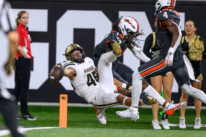 Sep 21, 2024; Corvallis, Oregon, USA; Purdue Boilermakers running back Devin Mockobee (45) reaches for the goal line during the second half against the Oregon State Beavers at Reser Stadium. Mandatory Credit: Craig Strobeck-Imagn Images