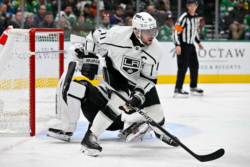 Jan 16, 2024; Dallas, Texas, USA; Los Angeles Kings center Anze Kopitar (11) collides with goaltender Cam Talbot (39) in the Kings zone during the second period against the Dallas Stars at the American Airlines Center. Mandatory Credit: Jerome Miron-USA TODAY Sports