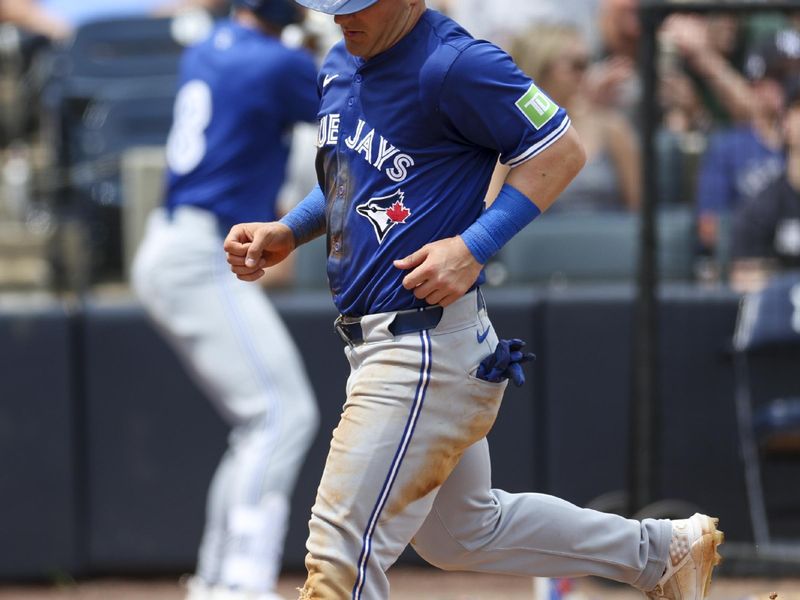 Mar 16, 2024; Tampa, Florida, USA;  Toronto Blue Jays left fielder Daulton Varsho (25) scores a run against the New York Yankees in the fourth inning at George M. Steinbrenner Field. Mandatory Credit: Nathan Ray Seebeck-USA TODAY Sports