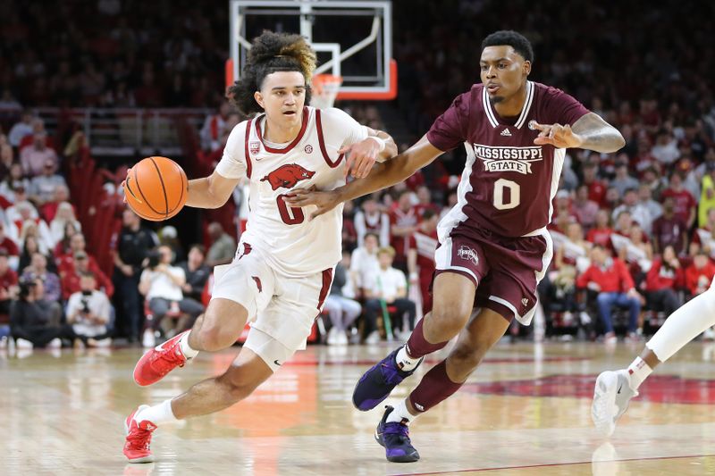 Feb 11, 2023; Fayetteville, Arkansas, USA; Arkansas Razorbacks guard Anthony Black (0) drives against Mississippi State Bulldogs forward D.J. Jeffries (0) during the first half at Bud Walton Arena. Mandatory Credit: Nelson Chenault-USA TODAY Sports