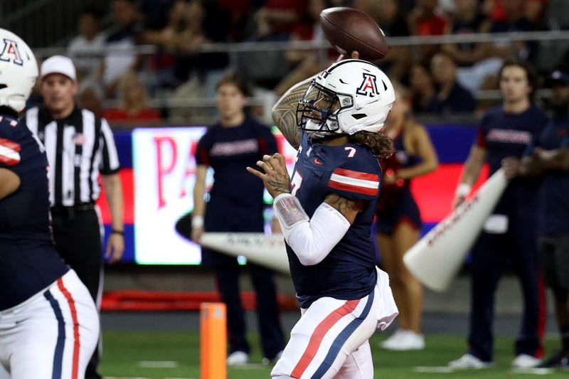 Sep 16, 2023; Tucson, Arizona, USA; Arizona Wildcats quarterback Jayden de Laura (7) makes a pass against the UTEP Miners during the first half at Arizona Stadium. Mandatory Credit: Zachary BonDurant-USA TODAY Sports