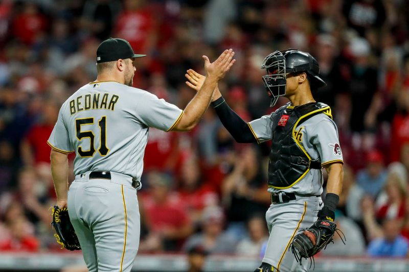 Sep 22, 2023; Cincinnati, Ohio, USA; Pittsburgh Pirates relief pitcher David Bednar (51) high fives catcher Endy Rodriguez (25) after the victory over the Cincinnati Reds at Great American Ball Park. Mandatory Credit: Katie Stratman-USA TODAY Sports