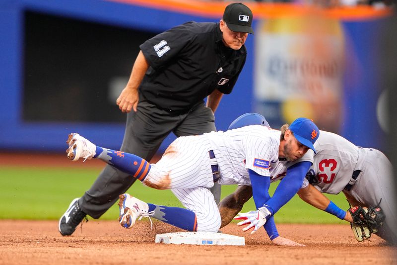 Jul 16, 2023; New York City, New York, USA; Los Angeles Dodgers right fielder Jason Heyward (23) is tagged out by New York Mets second baseman Jeff McNeil (1) attempting to stretch a single into a double during the second inning at Citi Field. Mandatory Credit: Gregory Fisher-USA TODAY Sports