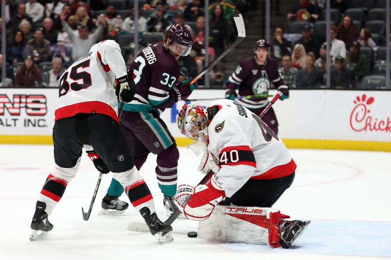 Mar 6, 2024; Anaheim, California, USA;  Ottawa Senators goaltender Mads Sogaard (40) makes a save against Anaheim Ducks right wing Jakob Silfverberg (33) during the second period at Honda Center. Mandatory Credit: Kiyoshi Mio-USA TODAY Sports