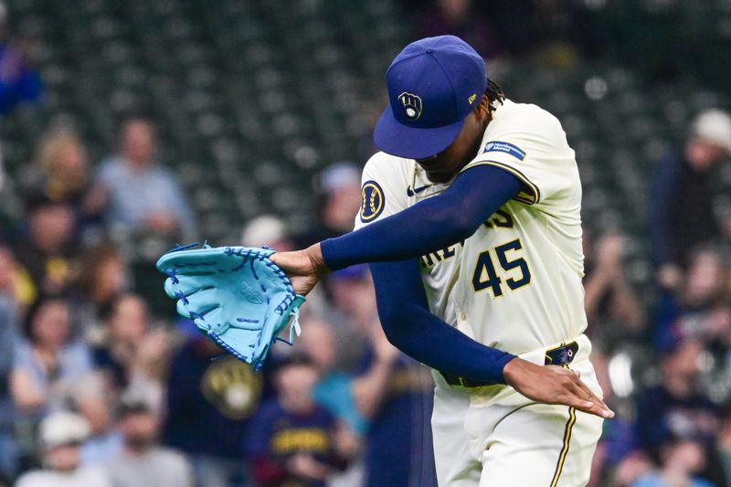 Apr 17, 2024; Milwaukee, Wisconsin, USA;  Milwaukee Brewers pitcher Abner Uribe (45) reacts after getting out of a jam in the eighth inning against the San Diego Padres at American Family Field. Mandatory Credit: Benny Sieu-USA TODAY Sports