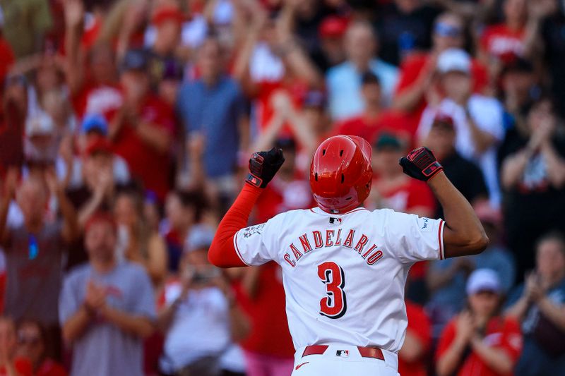 Jun 12, 2024; Cincinnati, Ohio, USA; Cincinnati Reds third baseman Jeimer Candelario (3) reacts after hitting a solo home run in the first inning against the Cleveland Guardians at Great American Ball Park. Mandatory Credit: Katie Stratman-USA TODAY Sports