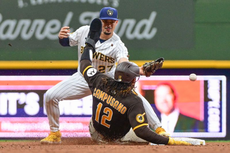 Aug 26, 2023; Milwaukee, Wisconsin, USA; San Diego Padres catcher Luis Campusano (12) is safe at second base after Milwaukee Brewers shortstop Willy Adames (27) drops the ball in the seventh inning at American Family Field. Mandatory Credit: Benny Sieu-USA TODAY Sports