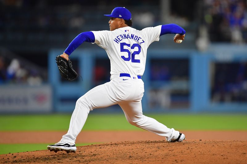 May 22, 2024; Los Angeles, California, USA; Los Angeles Dodgers pitcher Elieser Hernandez (52) throws against the Arizona Diamondbacks during the sixth inning at Dodger Stadium. Mandatory Credit: Gary A. Vasquez-USA TODAY Sports