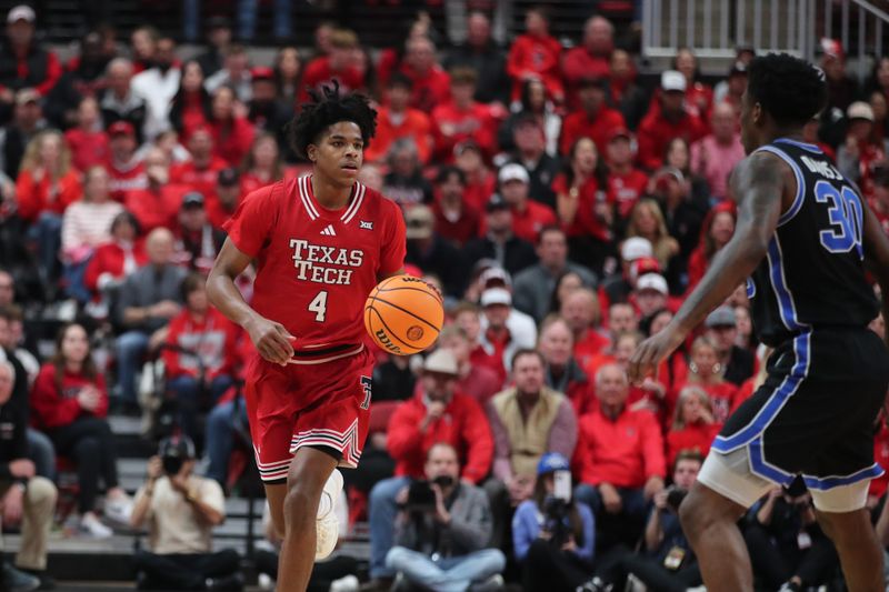 Jan 17, 2026; Lubbock, Texas, USA;  Texas Tech Red Raiders guard Christian Anderson (4) brings the ball up court against BYU Cougars guard Kennard Davis Jr. (30) in the first half at United Supermarkets Arena. Mandatory Credit: Michael C. Johnson-Imagn Images
