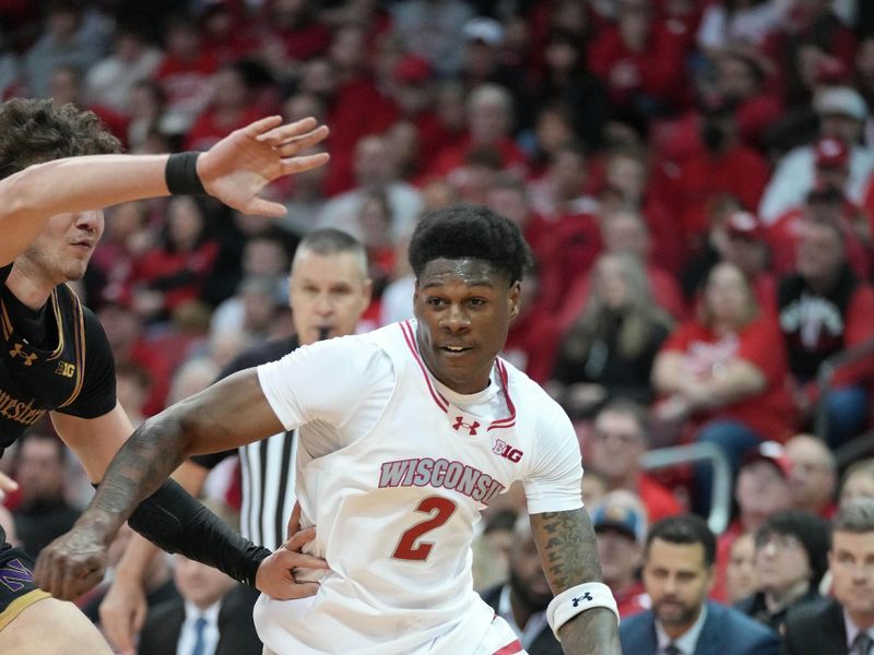 Jan 13, 2024; Madison, Wisconsin, USA; Wisconsin Badgers guard AJ Storr (2) dribbles the ball against Northwestern Wildcats forward Nick Martinelli (2) during the second half at the Kohl Center. Mandatory Credit: Kayla Wolf-USA TODAY Sports