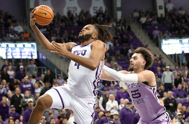 Jan 14, 2023; Fort Worth, Texas, USA;  TCU Horned Frogs center Eddie Lampkin Jr. (4) shoots past Kansas State Wildcats forward Ismael Massoud (25) during the first half at Ed and Rae Schollmaier Arena. Mandatory Credit: Kevin Jairaj-USA TODAY Sports