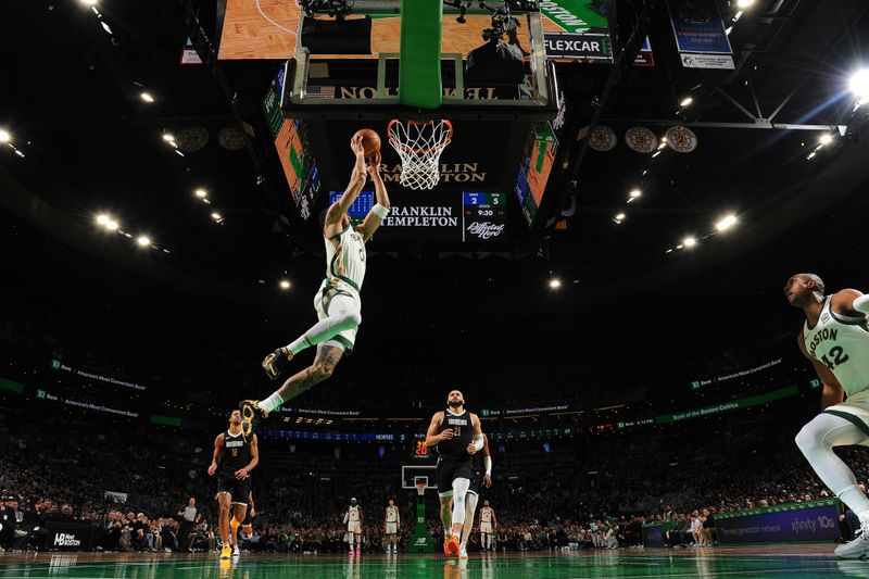 BOSTON, MA - FEBRUARY 4: Jayson Tatum #0 of the Boston Celtics dunks the ball during the game  against the Memphis Grizzlies  on February 4, 2024 at the TD Garden in Boston, Massachusetts. NOTE TO USER: User expressly acknowledges and agrees that, by downloading and or using this photograph, User is consenting to the terms and conditions of the Getty Images License Agreement. Mandatory Copyright Notice: Copyright 2024 NBAE  (Photo by Brian Babineau/NBAE via Getty Images)