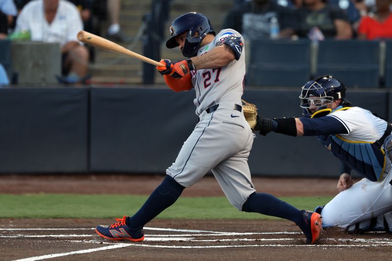 May 20, 2025; St. Petersburg, Florida, USA; Houston Astros outfielder Jose Altuve (27) singles against the Tampa Bay Rays during the first inning at George M. Steinbrenner Field. Mandatory Credit: Kim Klement Neitzel-Imagn Images