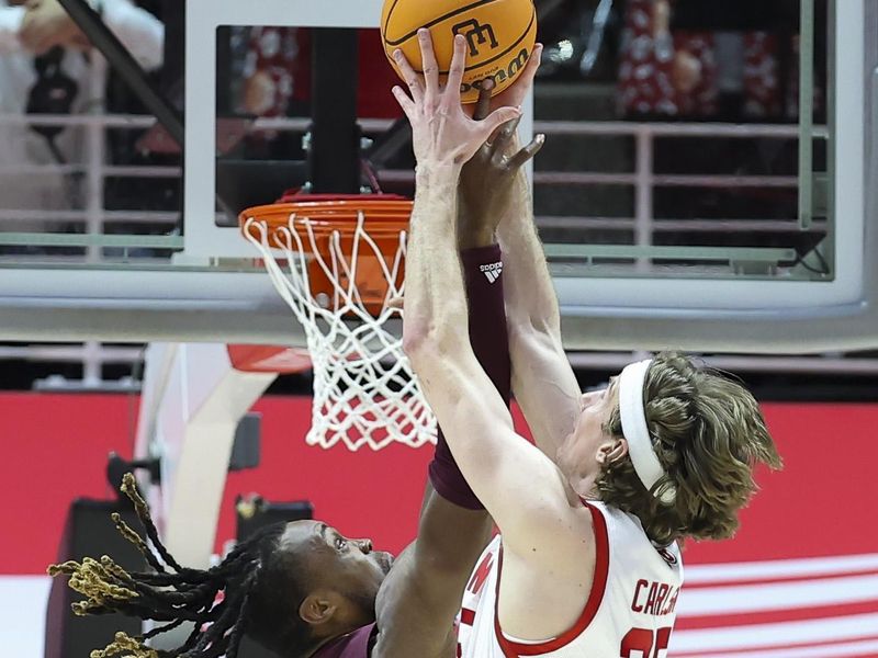 Feb 10, 2024; Salt Lake City, Utah, USA; Arizona State Sun Devils forward Bryant Selebangue (24) and Utah Utes center Branden Carlson (35) play for a rebound during the second half at Jon M. Huntsman Center. Mandatory Credit: Rob Gray-USA TODAY Sports