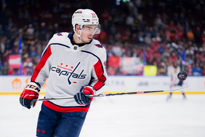 Mar 16, 2024; Vancouver, British Columbia, CAN; Washington Capitals forward Hendrix Lapierre (29) handles the puck during warm up prior to a game against the Vancouver Canucks at Rogers Arena.  Mandatory Credit: Bob Frid-USA TODAY Sports