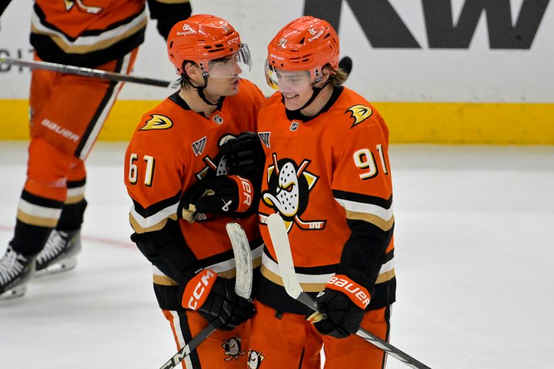 Apr 9, 2025; Anaheim, California, USA;  Anaheim Ducks left wing Cutter Gauthier (61) is congratulated by center Leo Carlsson (91) after a goal during the third period against the Calgary Flames as Honda Center. Mandatory Credit: Jayne Kamin-Oncea-Imagn Images