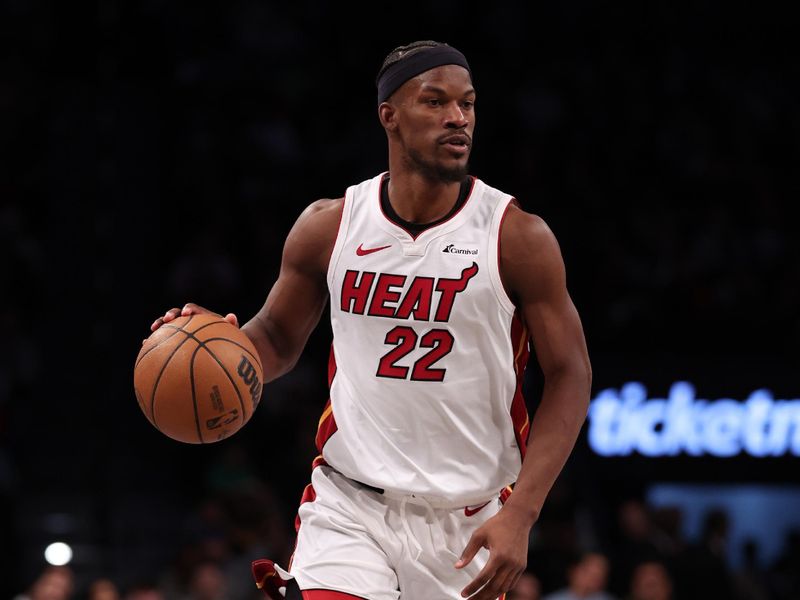 NEW YORK, NEW YORK - JANUARY 15:  Jimmy Butler #22 of the Miami Heat dibbles against the Brooklyn Nets during their game at Barclays Center on January 15, 2024 in New York City.   User expressly acknowledges and agrees that, by downloading and or using this photograph, User is consenting to the terms and conditions of the Getty Images License Agreement.  (Photo by Al Bello/Getty Images)