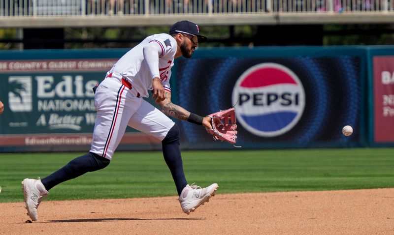 Mar 22, 2025; Fort Myers, Florida, USA; Minnesota Twins Carlos Correa (4) fields a ground ball in the third inning of there game against the  Toronto Blue at Lee Health Sports Complex. Mandatory Credit: Chris Tilley-Imagn Images