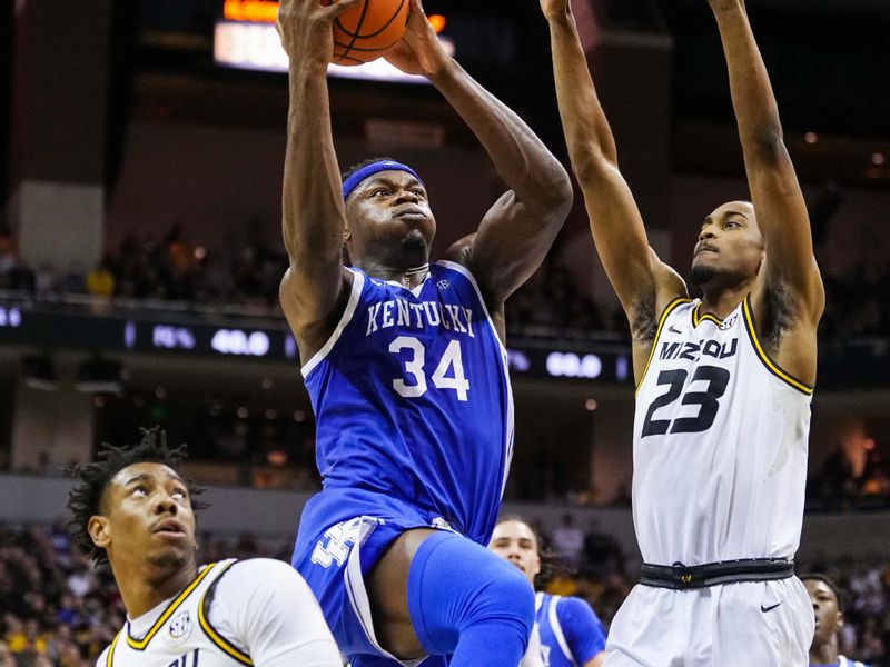 Dec 28, 2022; Columbia, Missouri, USA; Kentucky Wildcats forward Oscar Tshiebwe (34) goes up for a shot against Missouri Tigers guard DeAndre Gholston (4) and forward Aidan Shaw (23) during the second half at Mizzou Arena. Mandatory Credit: Jay Biggerstaff-USA TODAY Sports