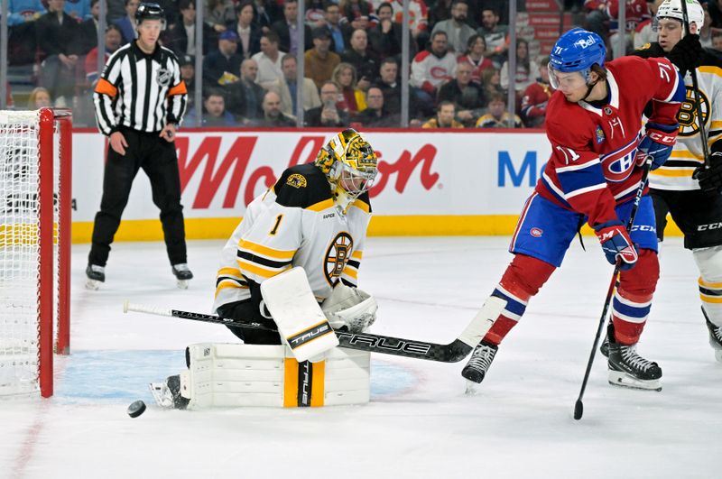 Apr 3, 2025; Montreal, Quebec, CAN; Boston Bruins goalie Jeremy Swayman (1) stops Montreal Canadiens forward Jake Evans (71) during the second period at the Bell Centre. Mandatory Credit: Eric Bolte-Imagn Images