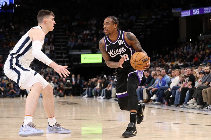 MEMPHIS, TENNESSEE - DECEMBER 05: DeMar DeRozan #10 of the Sacramento Kings handles the ball against Jake LaRavia #3 of the Memphis Grizzlies during the first half at FedExForum on December 05, 2024 in Memphis, Tennessee. NOTE TO USER: User expressly acknowledges and agrees that, by downloading and or using this photograph, User is consenting to the terms and conditions of the Getty Images License Agreement. (Photo by Justin Ford/Getty Images)