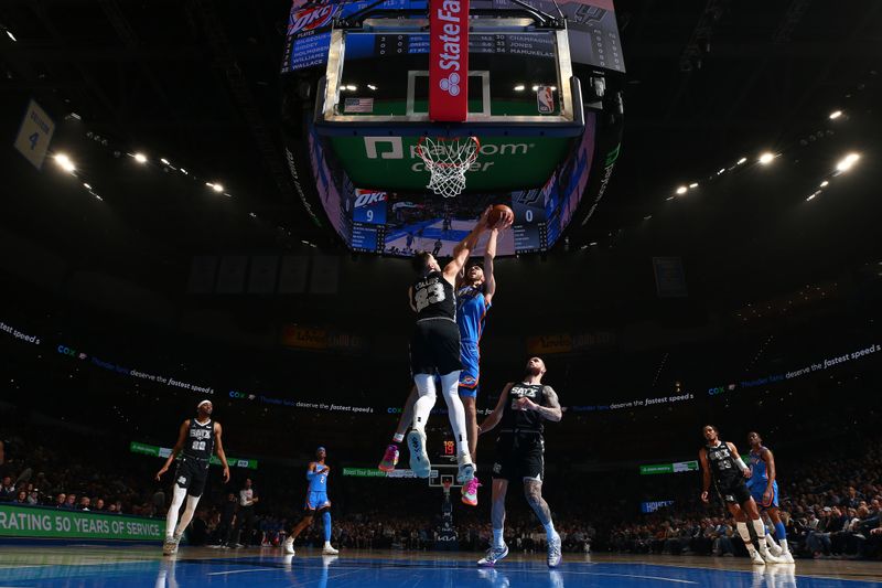 OKLAHOMA CITY, OK - APRIL 10:  Chet Holmgren #7 of the Oklahoma City Thunder drives to the basket during the game against the San Antonio Spurs on April 10, 2024 at Paycom Arena in Oklahoma City, Oklahoma. NOTE TO USER: User expressly acknowledges and agrees that, by downloading and or using this photograph, User is consenting to the terms and conditions of the Getty Images License Agreement. Mandatory Copyright Notice: Copyright 2024 NBAE (Photo by Zach Beeker/NBAE via Getty Images)