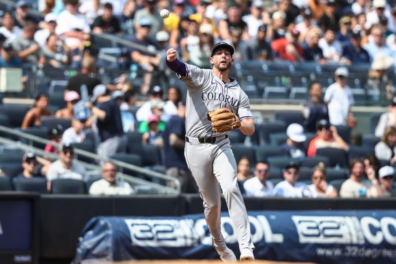 Aug 25, 2024; Bronx, New York, USA;  Colorado Rockies third baseman Ryan McMahon (24) throws a runner out at first base in the fourth inning against the New York Yankees at Yankee Stadium. Mandatory Credit: Wendell Cruz-USA TODAY Sports