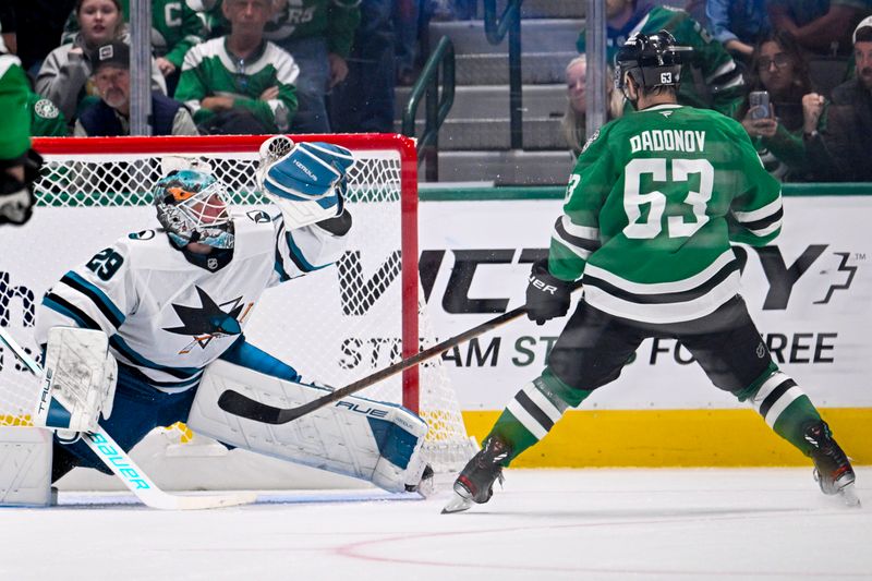 Oct 15, 2024; Dallas, Texas, USA; San Jose Sharks goaltender Mackenzie Blackwood (29) makes a glove save on a breakaway shot by Dallas Stars right wing Evgenii Dadonov (63) during the third period at the American Airlines Center. Mandatory Credit: Jerome Miron-Imagn Images