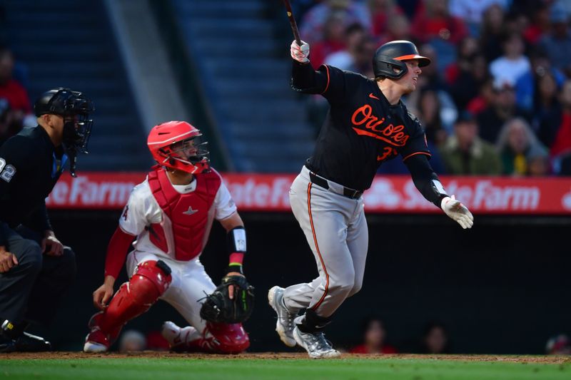 Apr 23, 2024; Anaheim, California, USA; Baltimore Orioles catcher Adley Rutschman (35) hits a single against the Los Angeles Angels during the fourth inning at Angel Stadium. Mandatory Credit: Gary A. Vasquez-USA TODAY Sports