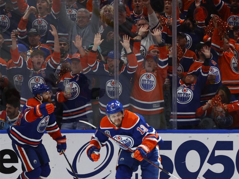 Jun 15, 2024; Edmonton, Alberta, CAN; Edmonton Oilers center Mattias Janmark (13) celebrates a goal in the first period against the Florida Panthers in game four of the 2024 Stanley Cup Final at Rogers Place. Mandatory Credit: Perry Nelson-USA TODAY Sports