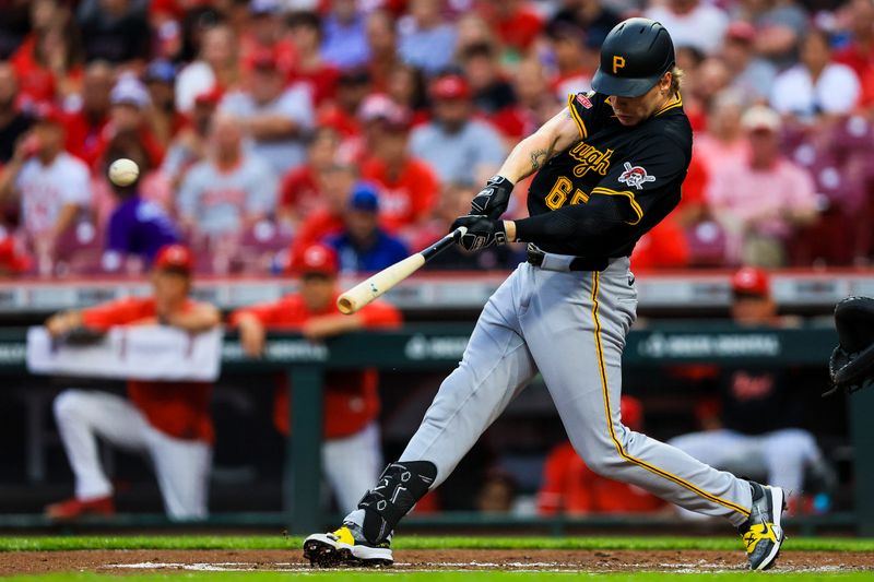 Sep 23, 2025; Cincinnati, Ohio, USA; Pittsburgh Pirates outfielder Jack Suwinski (65) hits a double in the second inning against the Cincinnati Reds at Great American Ball Park. Mandatory Credit: Katie Stratman-Imagn Images